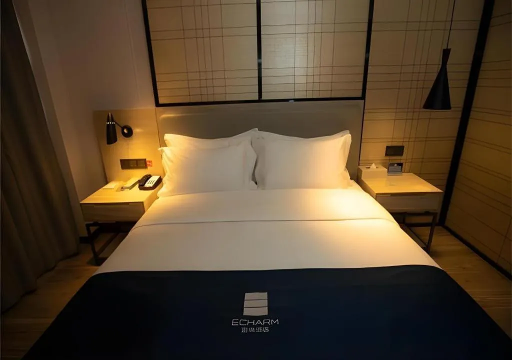 Bed in Echarm Hotel Zibo Gaoqing Zhongcheng Inernational