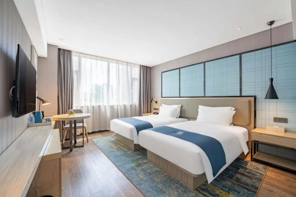 Bed in Echarm Hotel Zibo Gaoqing Zhongcheng Inernational