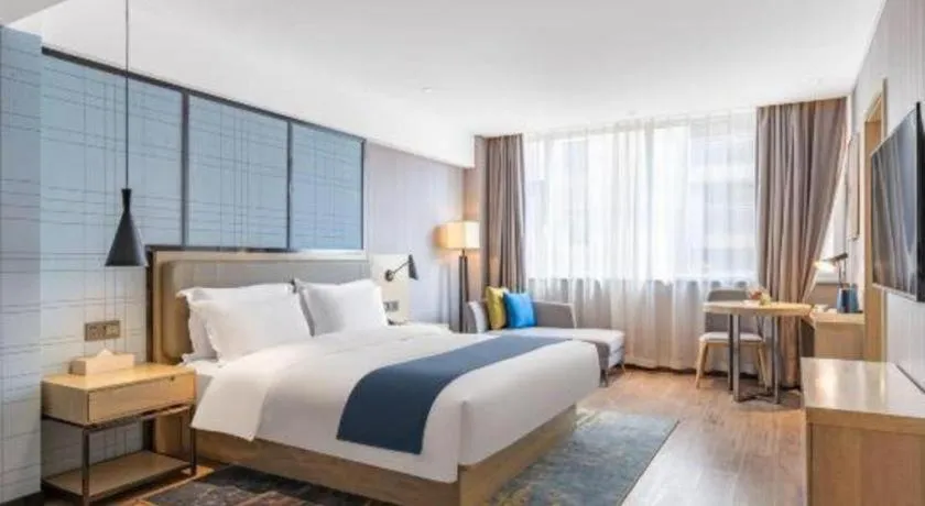 Bed in Echarm Hotel Zibo Gaoqing Zhongcheng Inernational