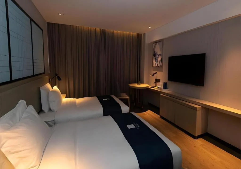 Bed in Echarm Hotel Zibo Gaoqing Zhongcheng Inernational