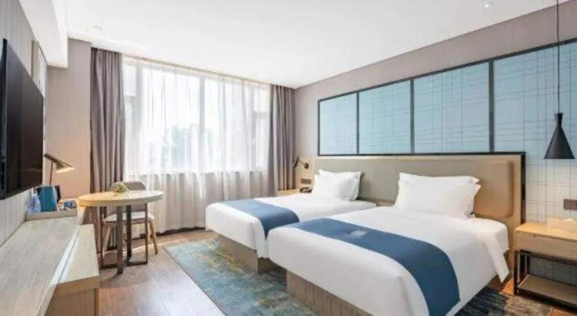 Bed in Echarm Hotel Zibo Gaoqing Zhongcheng Inernational