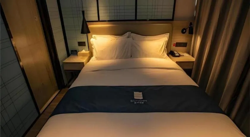 Bed in Echarm Hotel Zibo Gaoqing Zhongcheng Inernational