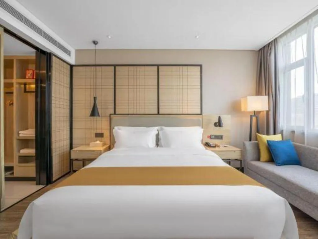 Bed in Echarm Hotel Zibo Gaoqing Zhongcheng Inernational