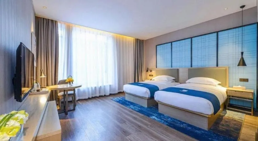 Bed in Echarm Hotel Kunming Railway Station Huancheng South Road Metro Station