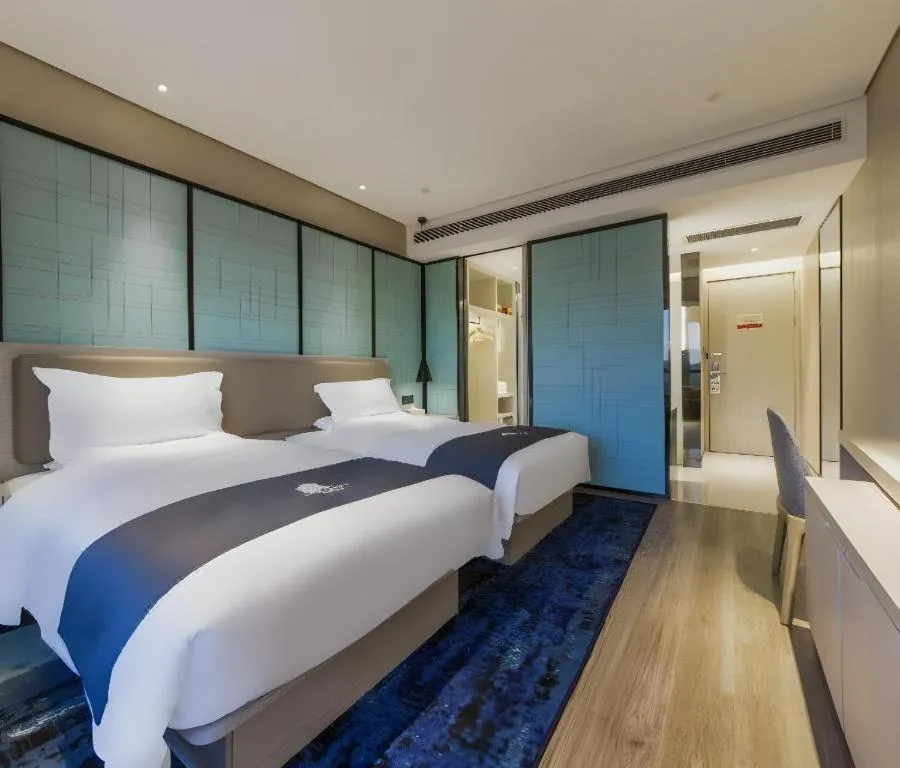 Bed in Echarm Hotel Kunming Railway Station Huancheng South Road Metro Station