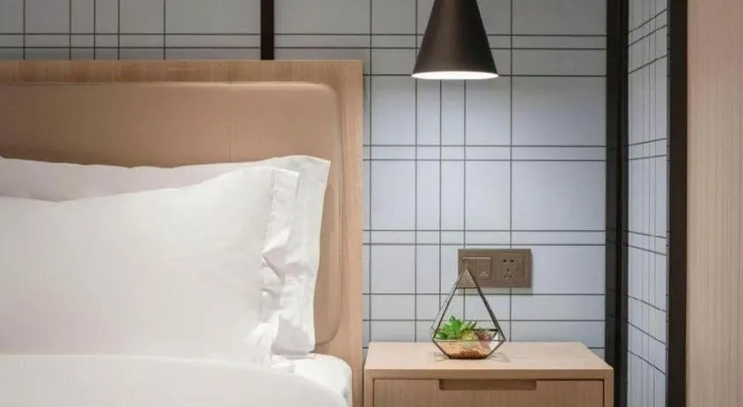 Bed in Echarm Hotel Kunming Railway Station Huancheng South Road Metro Station