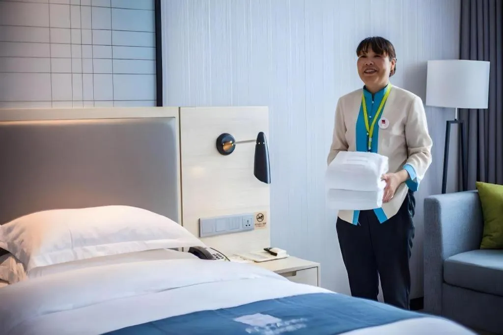 Bed in Echarm Hotel Kunming Railway Station Huancheng South Road Metro Station