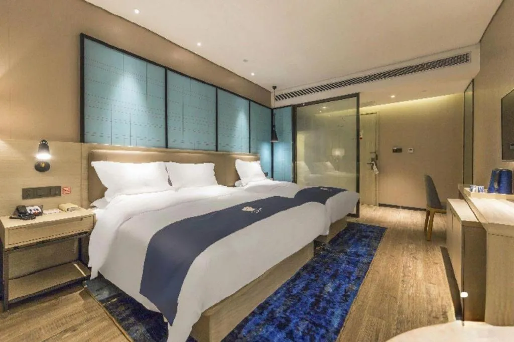 Bed in Echarm Hotel Kunming Railway Station Huancheng South Road Metro Station