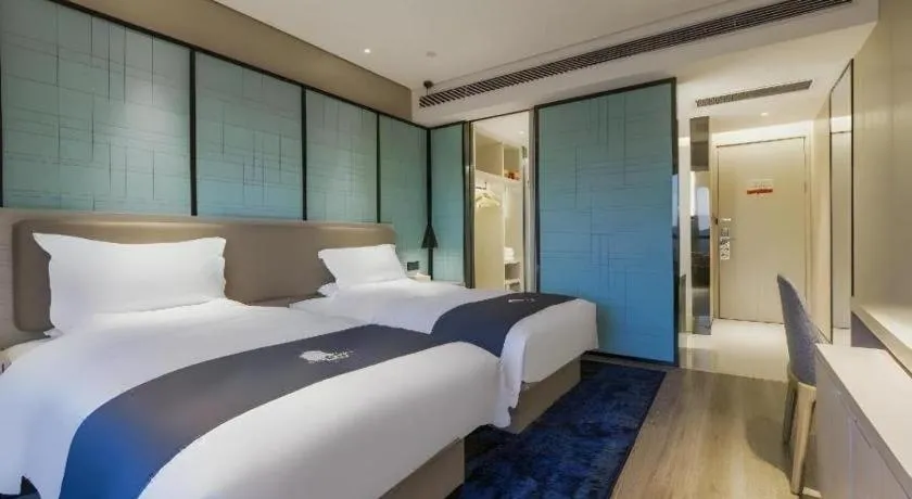 Bed in Echarm Hotel Kunming Railway Station Huancheng South Road Metro Station