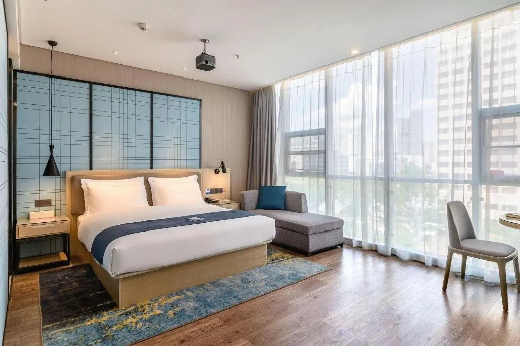 Bed in Echarm Hotel Kunming Railway Station Huancheng South Road Metro Station