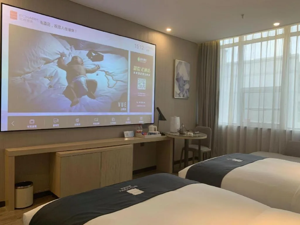 Bed in Echarm Hotel Kunming Railway Station Huancheng South Road Metro Station