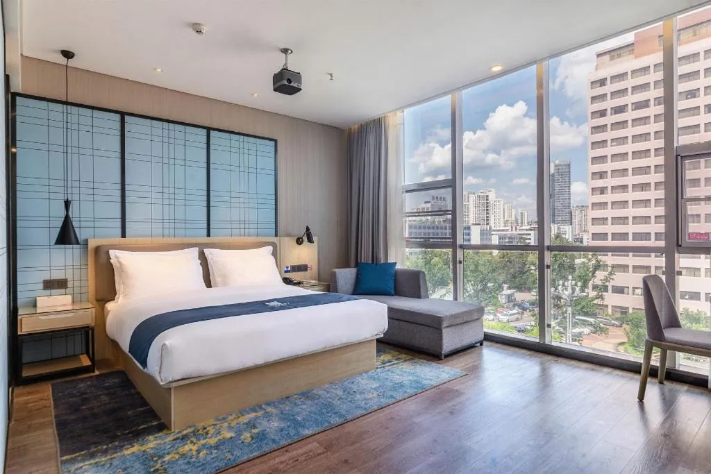 Bed in Echarm Hotel Kunming Railway Station Huancheng South Road Metro Station