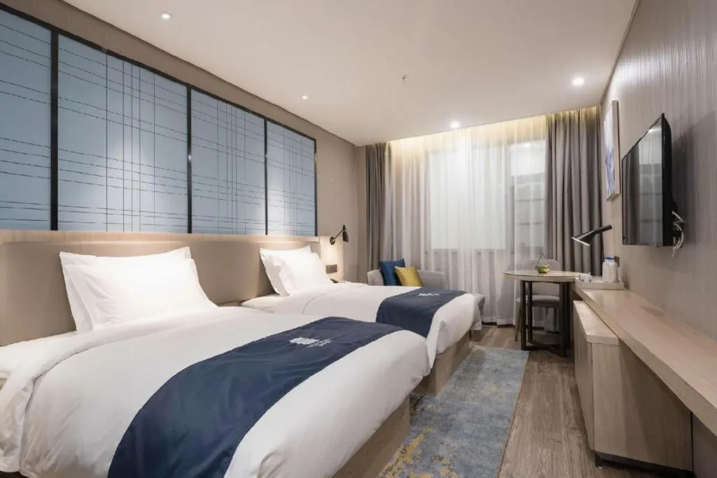 Bed in Echarm Hotel Kunming Railway Station Huancheng South Road Metro Station