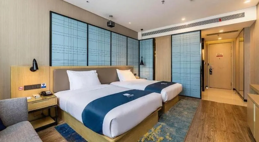Bed in Echarm Hotel Kunming Railway Station Huancheng South Road Metro Station