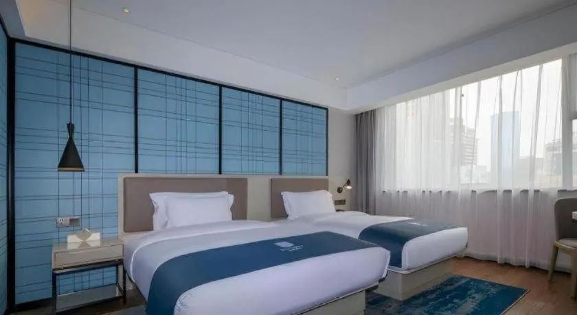 Bed in Echarm Hotel Kunming Railway Station Huancheng South Road Metro Station