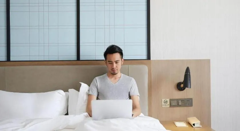 Bed in Echarm Hotel Kunming Railway Station Huancheng South Road Metro Station