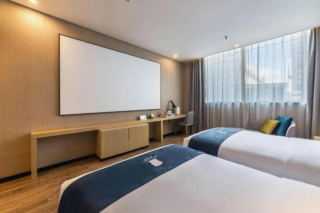 Bed in Echarm Hotel Kunming Railway Station Huancheng South Road Metro Station