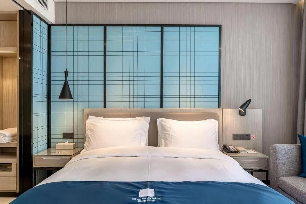 Bed in Echarm Hotel Kunming Railway Station Huancheng South Road Metro Station