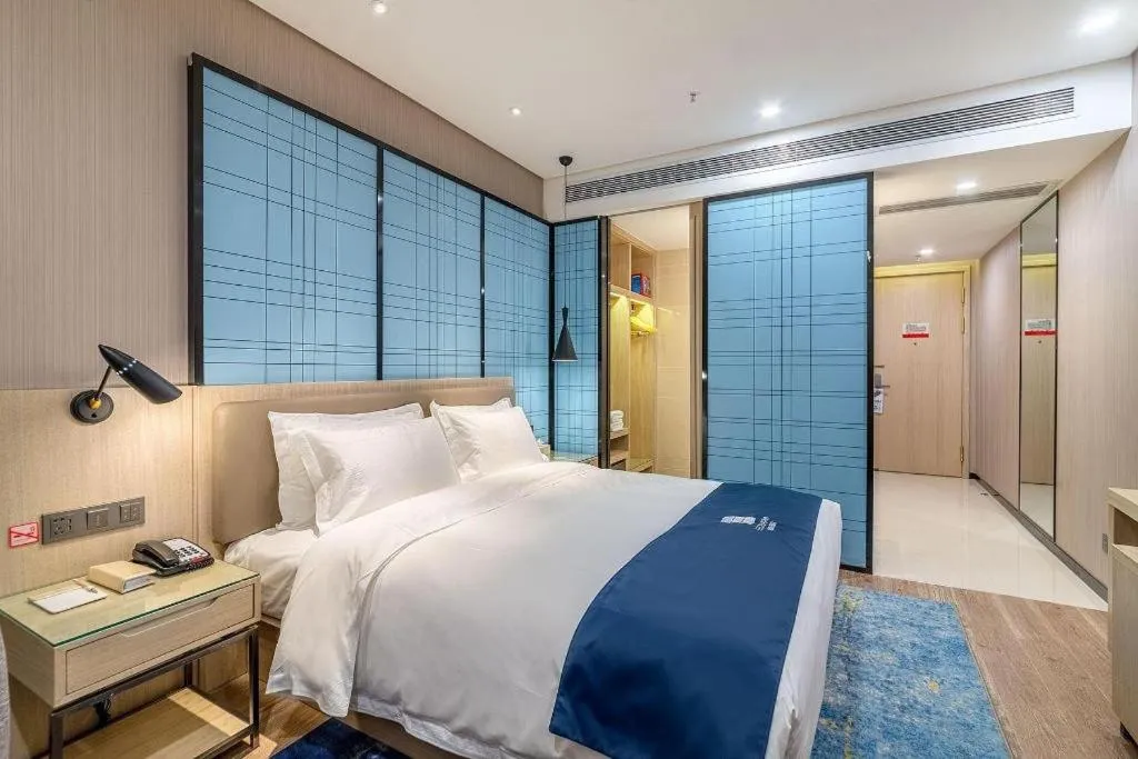 Bed in Echarm Hotel Kunming Railway Station Huancheng South Road Metro Station