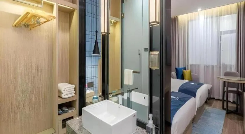 Bed in Echarm Hotel Kunming Railway Station Huancheng South Road Metro Station