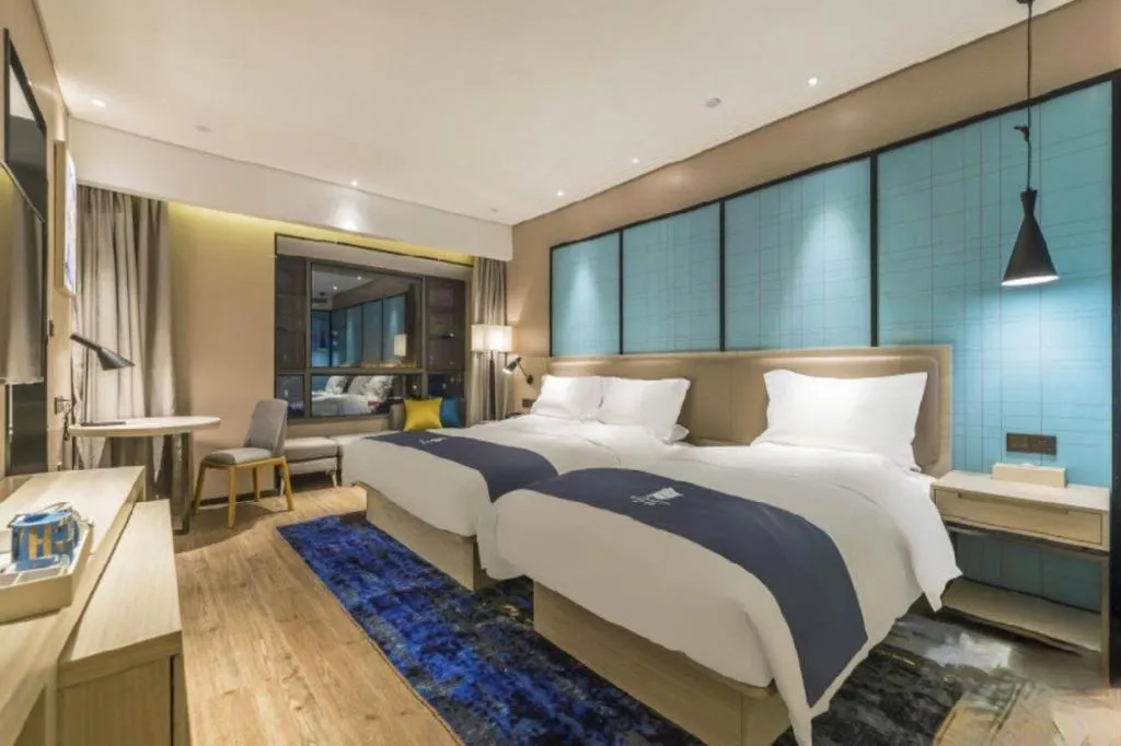 Bed in Echarm Hotel Kunming Railway Station Huancheng South Road Metro Station