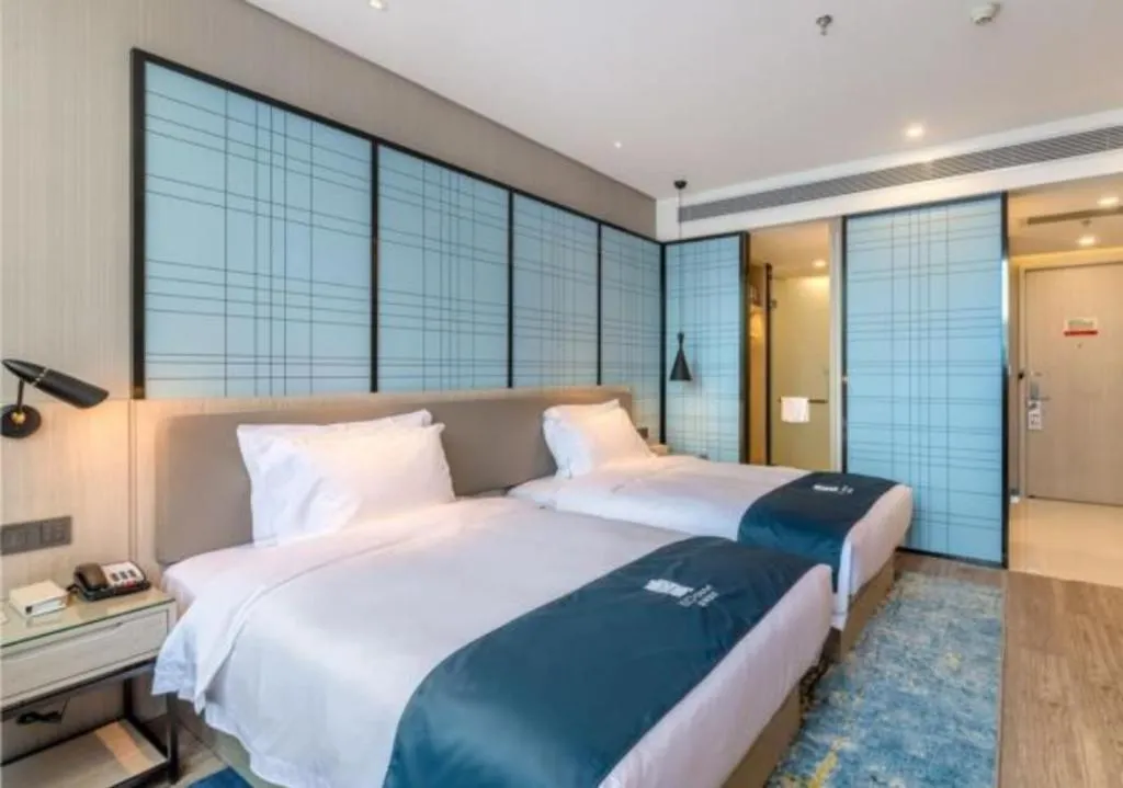 Bed in Echarm Hotel Kunming Railway Station Huancheng South Road Metro Station
