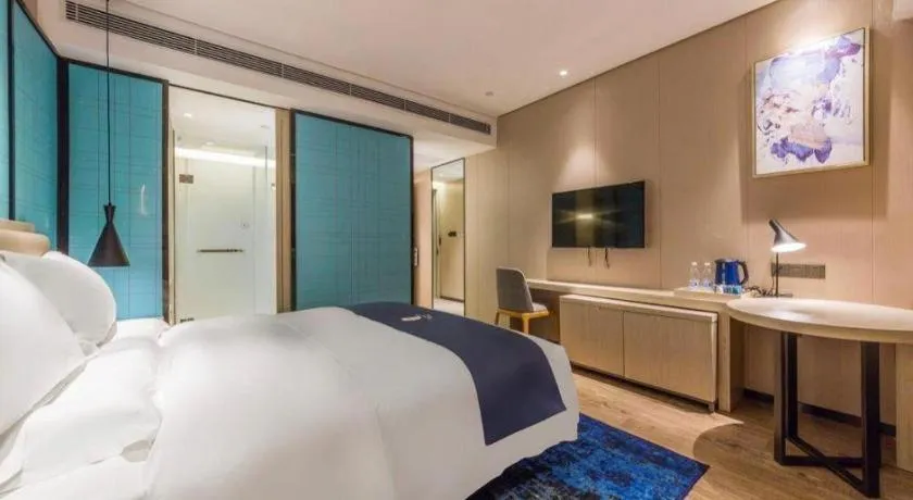 Bed in Echarm Hotel Kunming Railway Station Huancheng South Road Metro Station