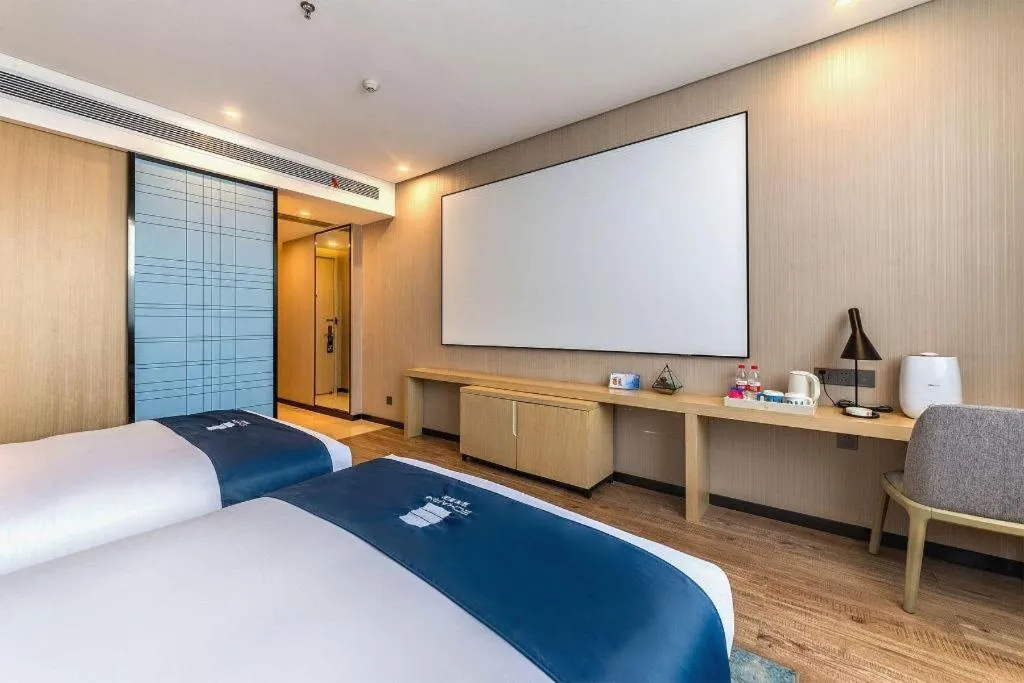 Bed in Echarm Hotel Kunming Railway Station Huancheng South Road Metro Station