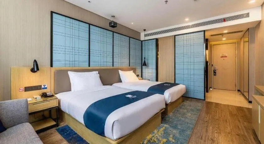 Bed in Echarm Hotel Kunming Railway Station Huancheng South Road Metro Station