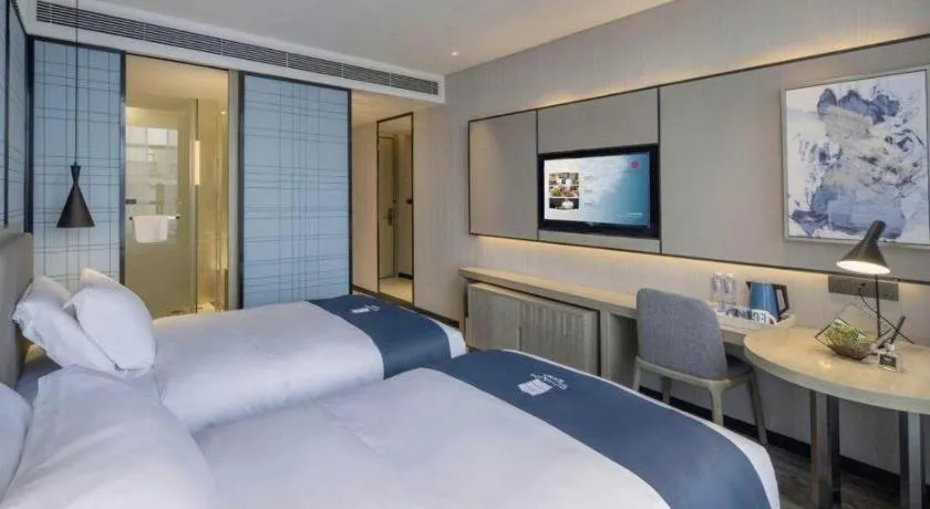 Bed in Echarm Hotel Kunming Railway Station Huancheng South Road Metro Station