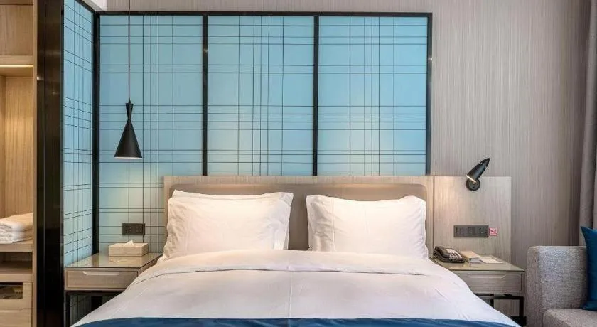 Bed in Echarm Hotel Kunming Railway Station Huancheng South Road Metro Station