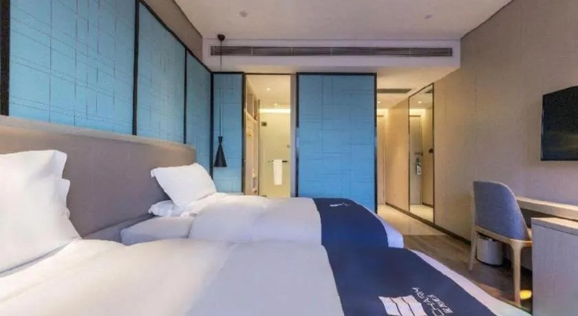 Bed in Echarm Hotel Kunming Railway Station Huancheng South Road Metro Station