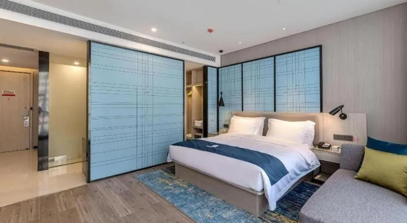 Bed in Echarm Hotel Kunming Railway Station Huancheng South Road Metro Station