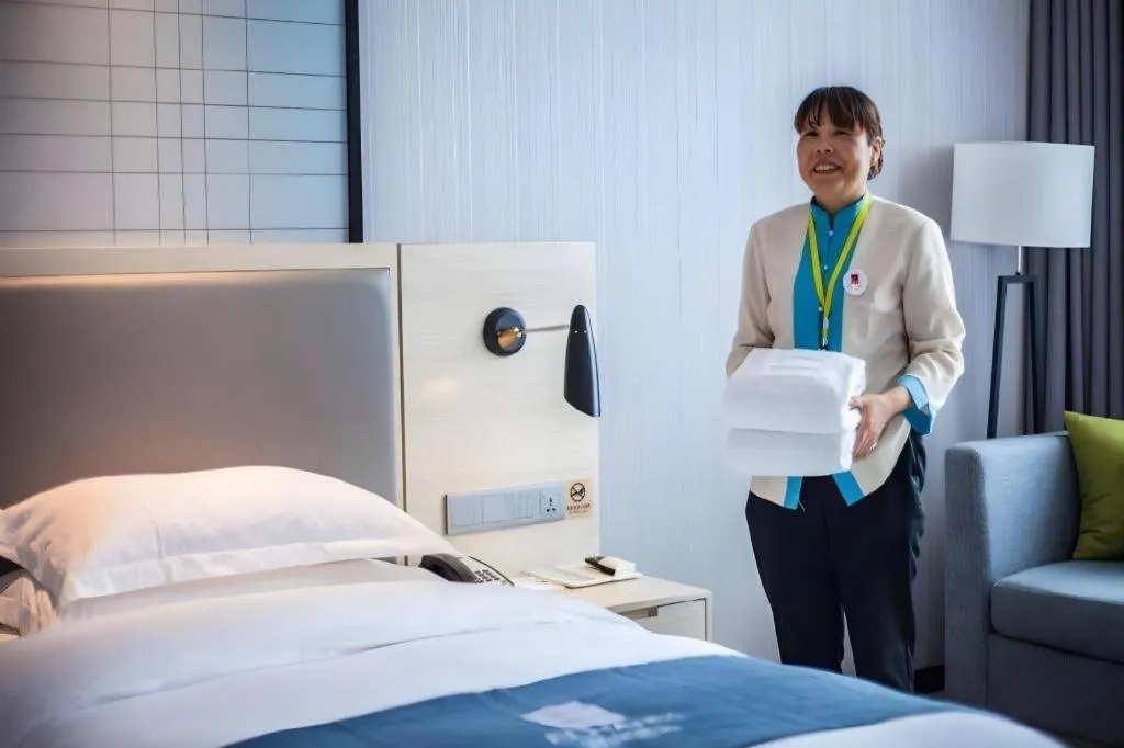 Bed in Echarm Hotel Kunming Railway Station Huancheng South Road Metro Station