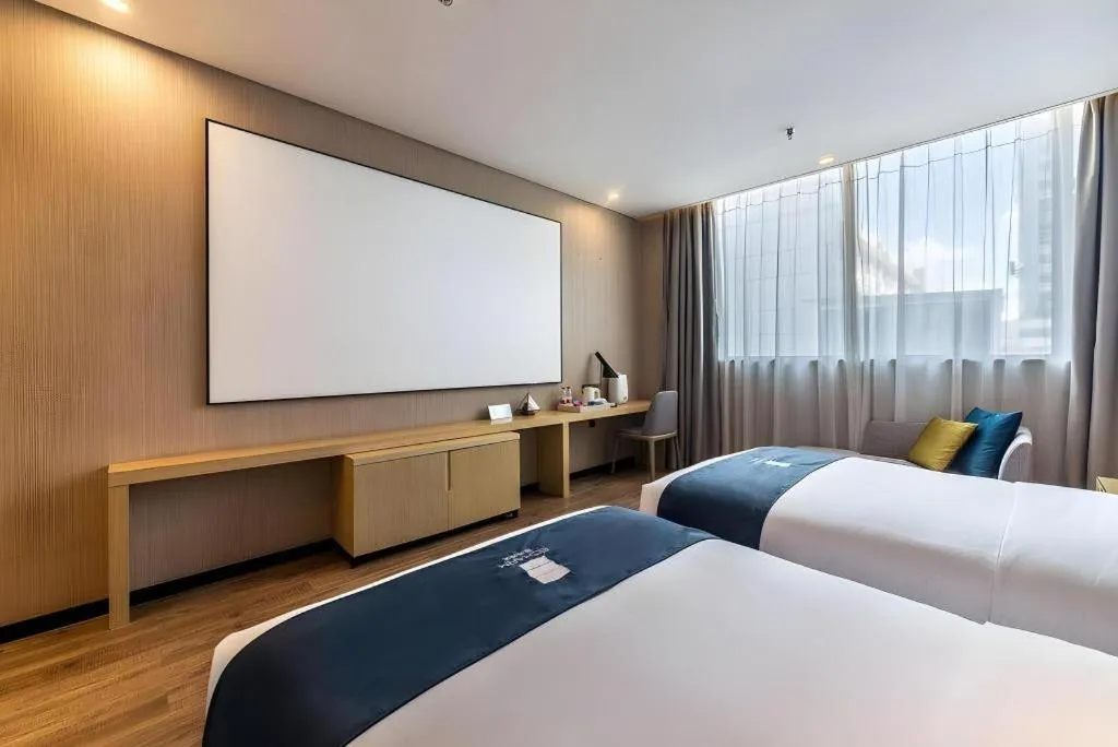 Bed in Echarm Hotel Kunming Railway Station Huancheng South Road Metro Station