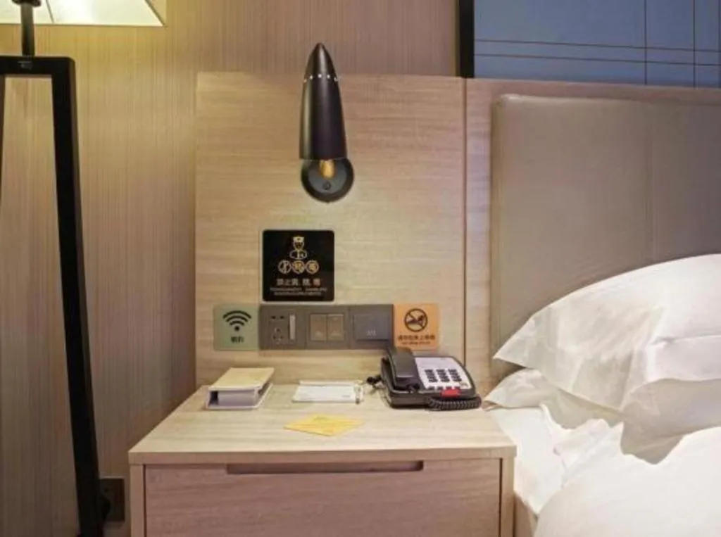 Bed in Echarm Hotel Kunming Railway Station Huancheng South Road Metro Station