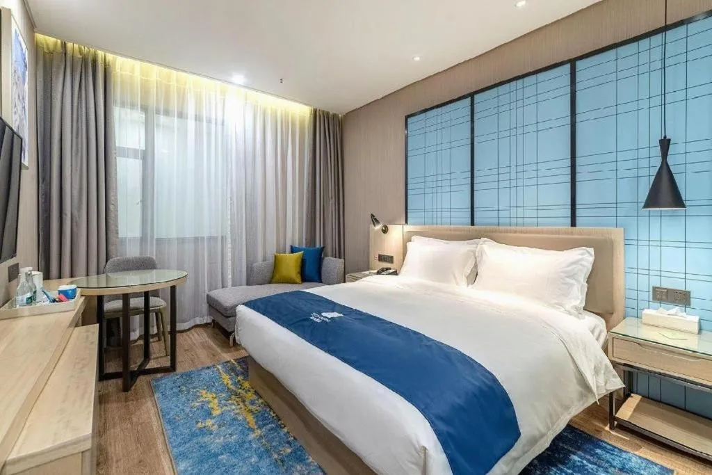 Bed in Echarm Hotel Kunming Railway Station Huancheng South Road Metro Station