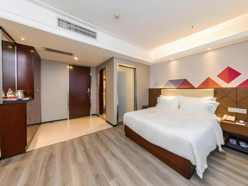 Bed in Borrman Hotel Guangzhou Railway Station Sanyuanli Metro Station