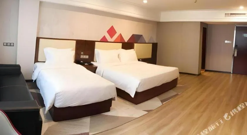 Bed in Borrman Hotel Guangzhou Railway Station Sanyuanli Metro Station