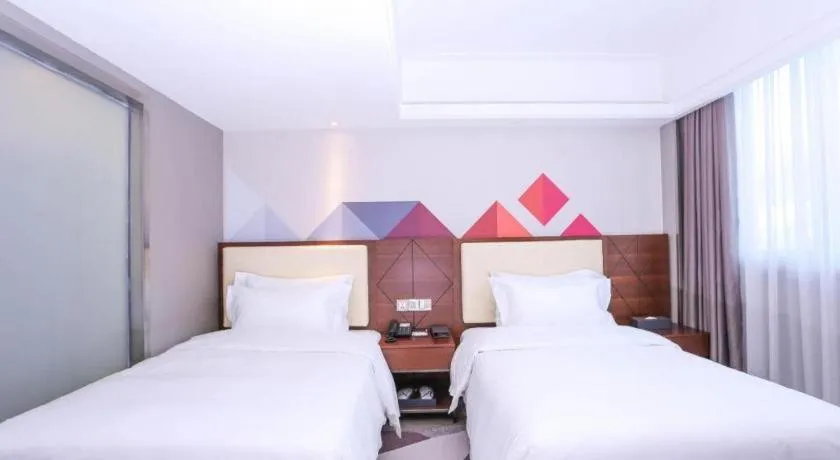 Bed in Borrman Hotel Guangzhou Railway Station Sanyuanli Metro Station