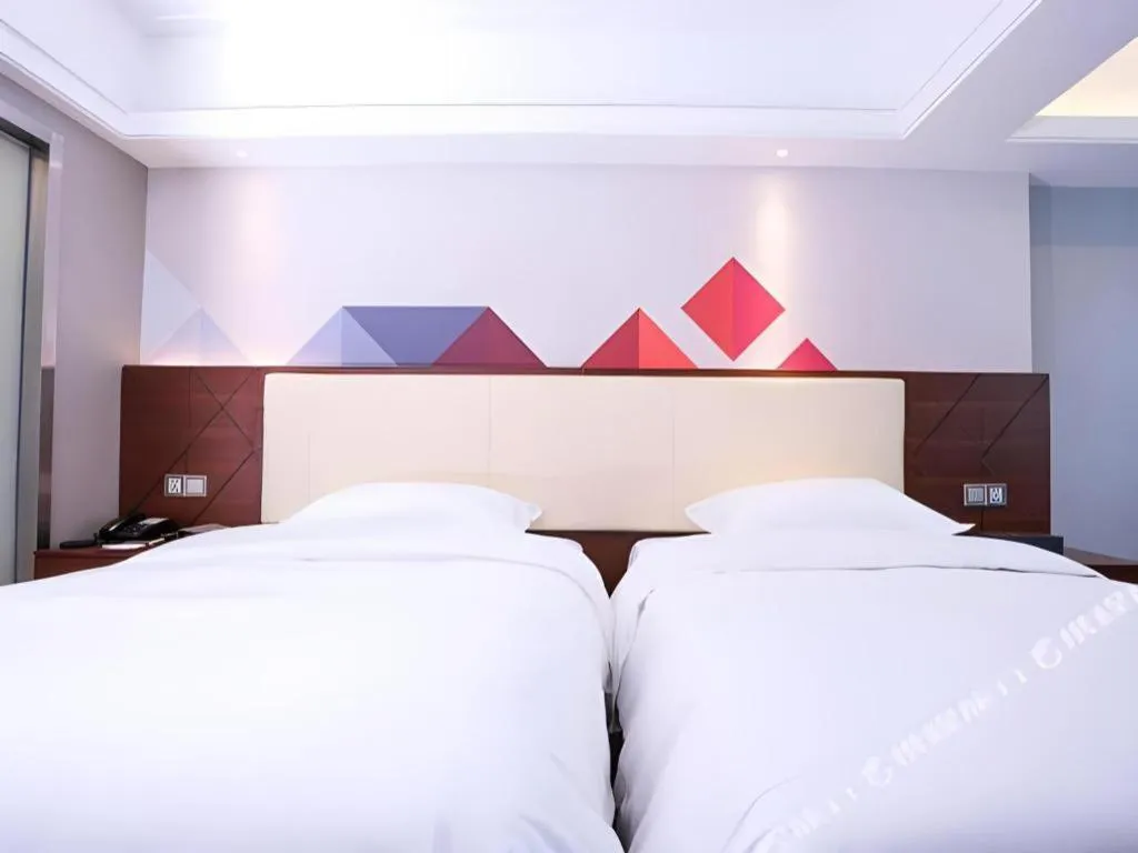 Bed in Borrman Hotel Guangzhou Railway Station Sanyuanli Metro Station