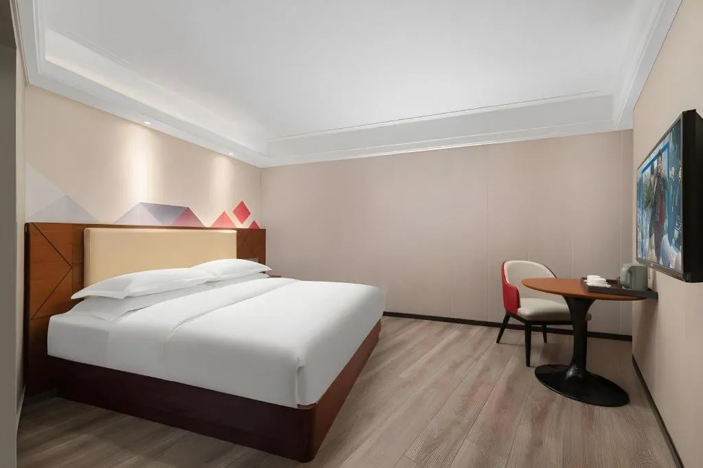 Bed in Borrman Hotel Guangzhou Railway Station Sanyuanli Metro Station