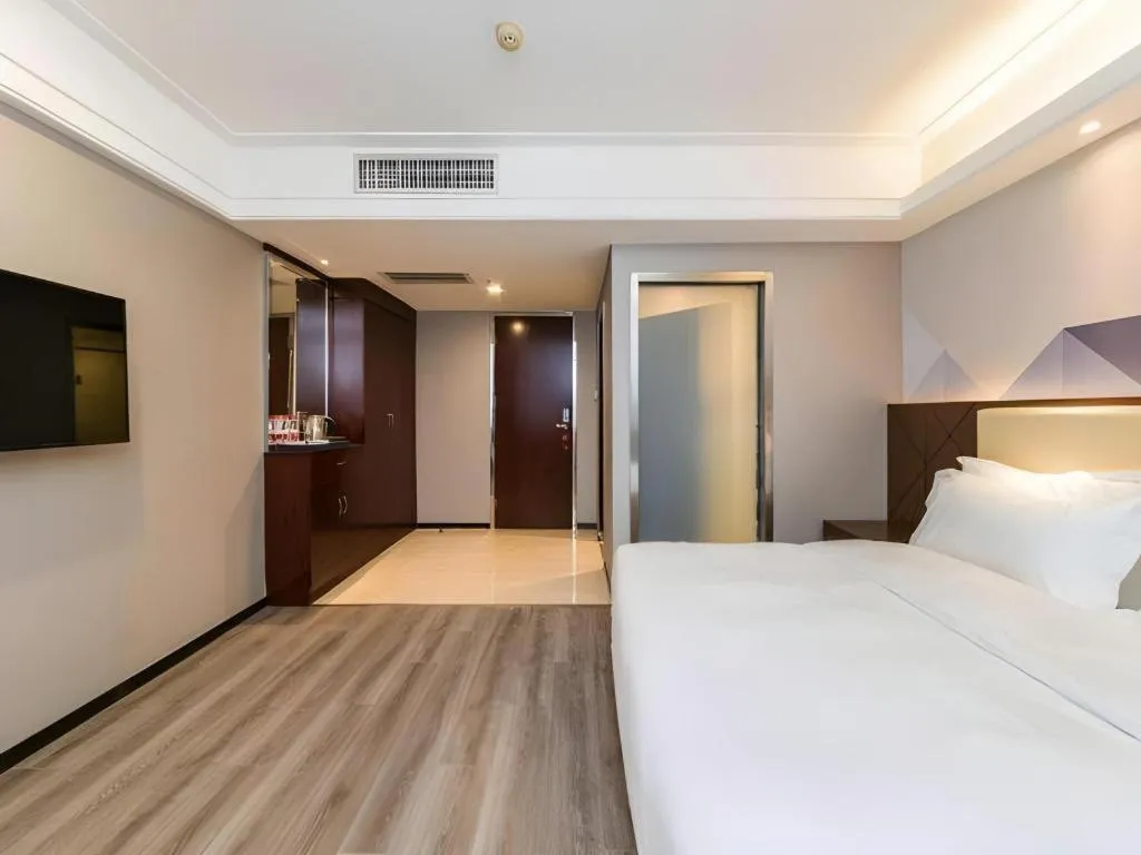 Bed in Borrman Hotel Guangzhou Railway Station Sanyuanli Metro Station