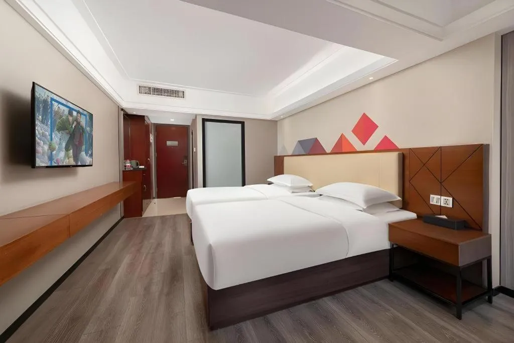 Bed in Borrman Hotel Guangzhou Railway Station Sanyuanli Metro Station