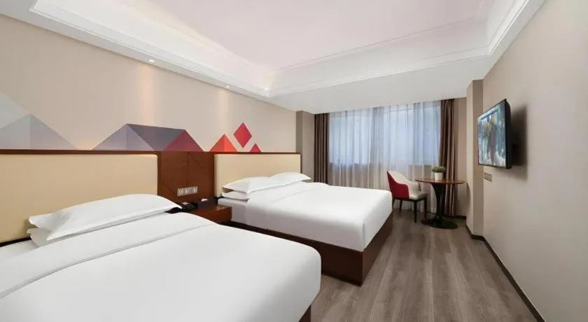 Bed in Borrman Hotel Guangzhou Railway Station Sanyuanli Metro Station