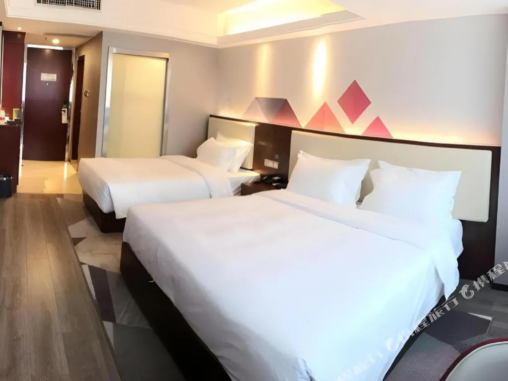 Bed in Borrman Hotel Guangzhou Railway Station Sanyuanli Metro Station