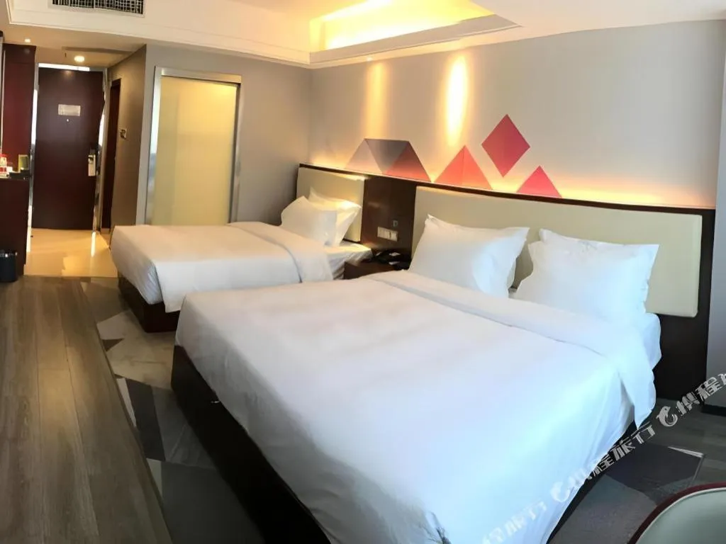 Bed in Borrman Hotel Guangzhou Railway Station Sanyuanli Metro Station