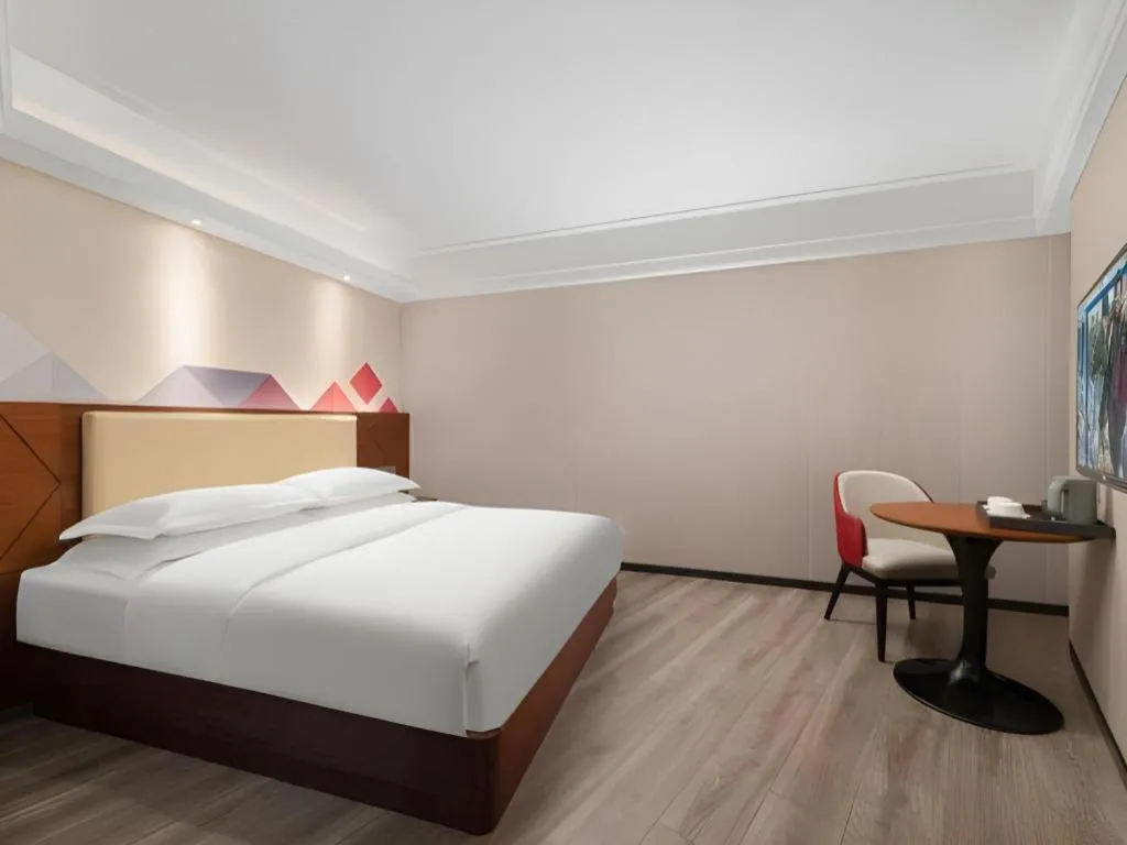 Bed in Borrman Hotel Guangzhou Railway Station Sanyuanli Metro Station