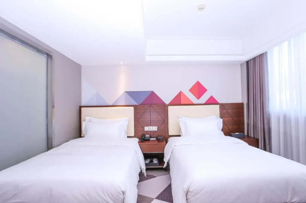 Bed in Borrman Hotel Guangzhou Railway Station Sanyuanli Metro Station