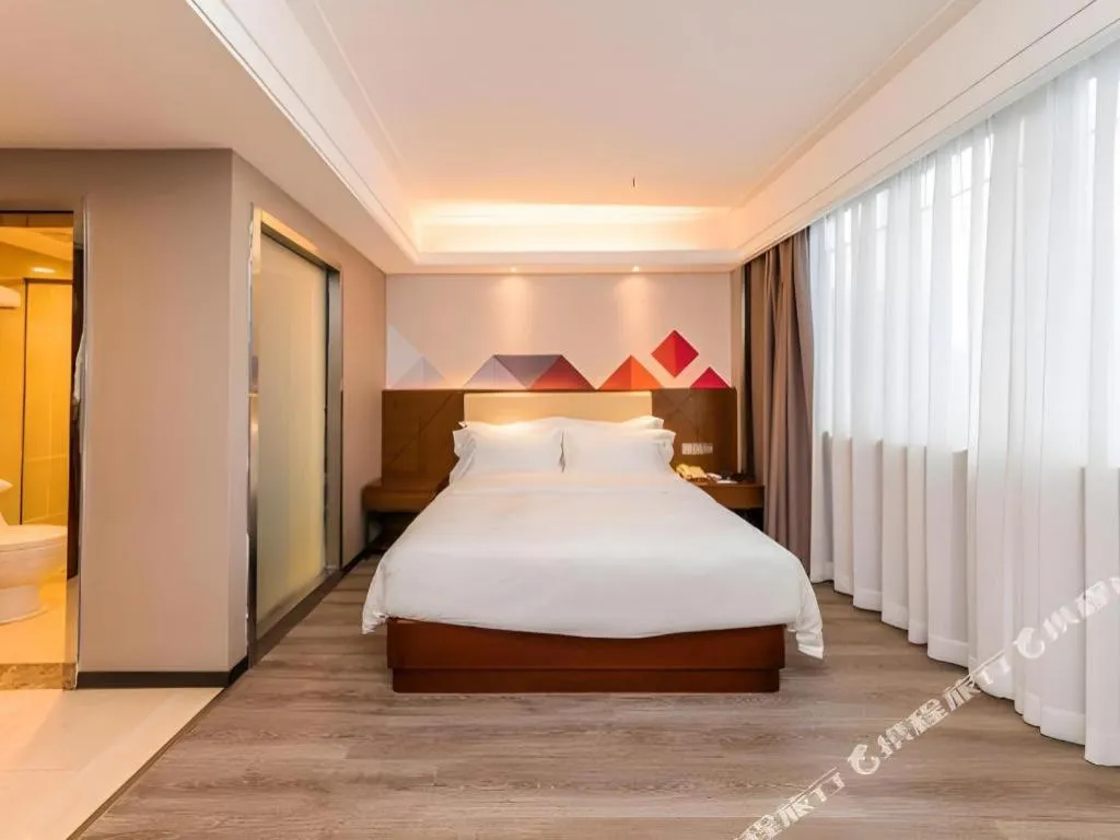 Bed in Borrman Hotel Guangzhou Railway Station Sanyuanli Metro Station